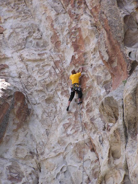 Brian climbing the steep patina face...