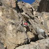 Ron Olsen traversing right to the good ledge.  Photo by Greg Hand.