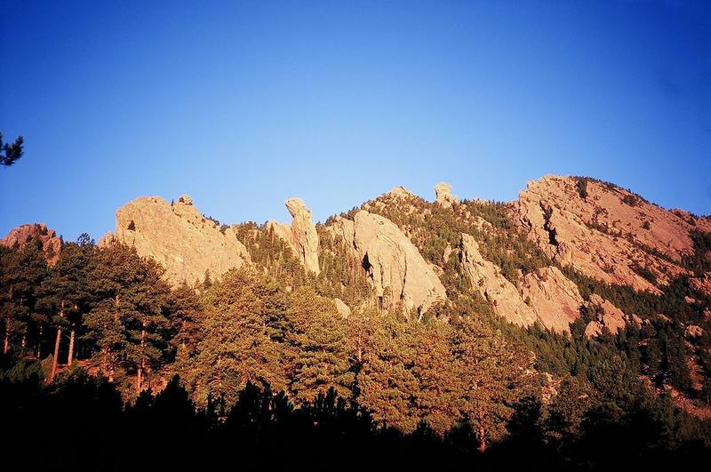 From left to right... The Tower of The Moon (small, shaded), the Jamcrack Spire, the Maiden, the Fatiron, The Devil's Thumb, the Flying Flatiron, and the Devil's Wings as viewed from the South-East on the Old Mesa Trail.