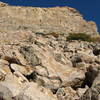 The approach heading east up to the wall.  The smaller boulders are further north; they are safer to climb than the large boulders.