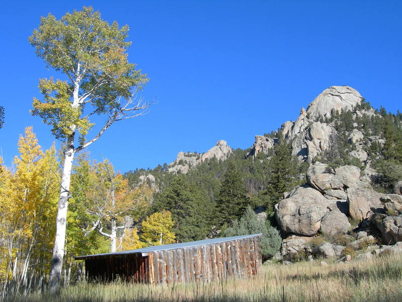 Looking up at Batman Rock & Batman Pinnacle from the cattle shelter along the Lumpy Ridge trail.