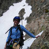 Nancy Bell with the top half of Chaos Couloir in the background.