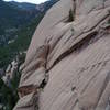 Looking past the Sun from Teepee Tower Crack on Wigwam Dome. Note the beautiful water grooves. And note that rock formation in the distance at the end of the valley. We hiked past that on our first time approach to Wigwam.