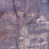 Jonny nearing the anchors atop pitch 2, after leading the sustained chimney.