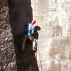 Jason cranking the crux moves on the unknown sport climb