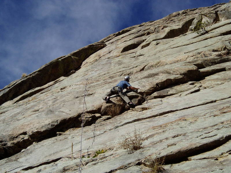 Starting the tricky P1 crux bulge. Photo by Paul Rezucha.