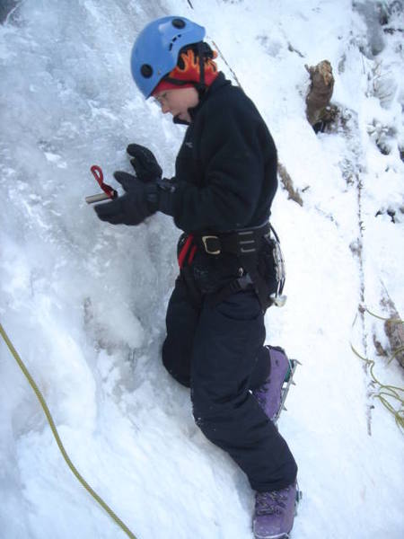 Christian placing his first screw at the bottom of Great White.