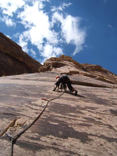 On pitch 3 the crack starts to disappear.  The slightly steeper 4th pitch can be seen beyond the second overlap up above.