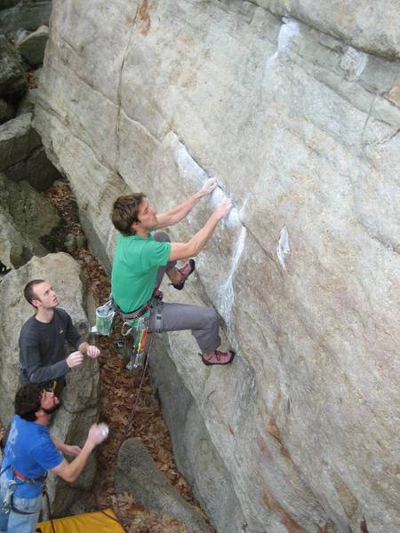 Getting set up for the boulder problem on The Sting, which is a big lunge to the next horizontal. Photo Kayte Knower. 