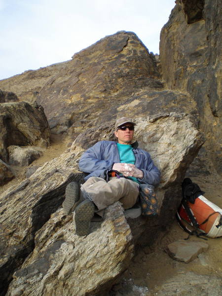 Relaxing at the base of Hueco Wall.  Nice seat!