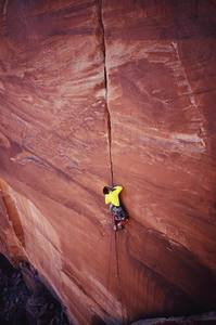 Tony Bubb approaching better jams on "Low Spark". (5.11, Sparks Wall, Indian Creek). Photo November 2006 by David Stuart.