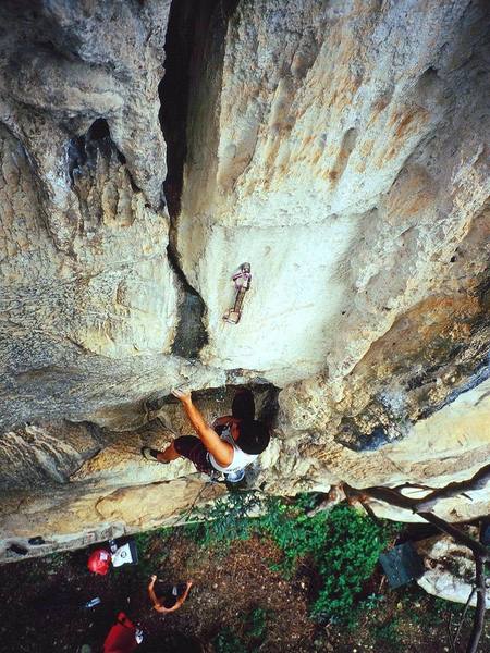 Kenny Low starting up a 6b at Nanyang Wall, in the Batu Caves area of K.L., Malaysia. Photo by Tony Bubb, 12/06.