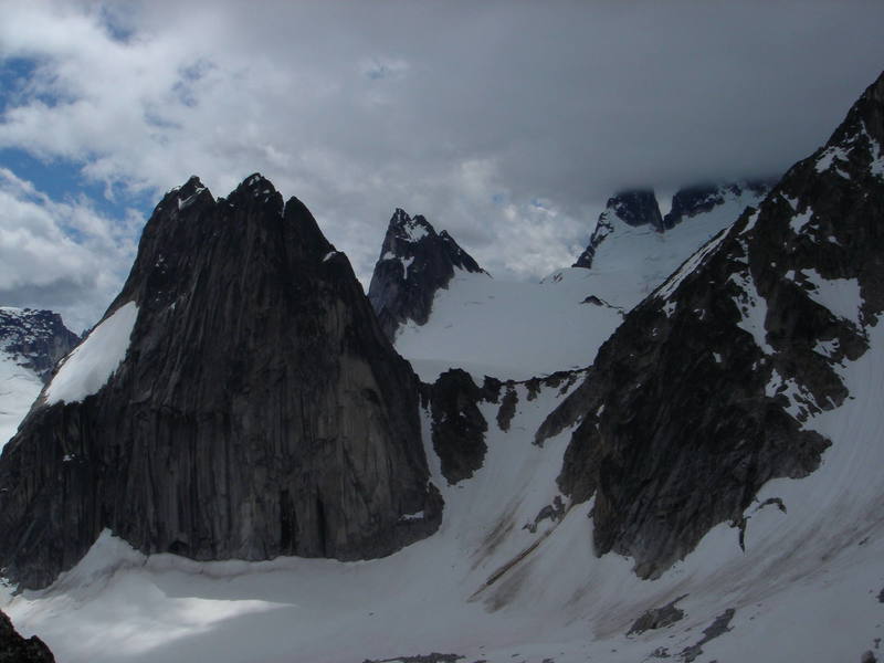 The Bugaboo (R) - Snowpatch (L) col - gateway to adventure!  Pigeon Spire  and the Howsers (in cloud) visible behind. (view from Cresent Spires) 