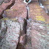 Peter Spindloe leads Handcrack (10b) on the West Ridge in Eldorado Canyon, CO. Photo by T0ny Bubb, 2001.