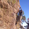 Robbie hanging onto Corner Rock, Andy spotting.