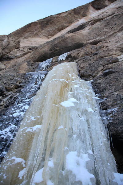 Climb up a short step, then tunnel through squeeze chimneys to cliff band summit.  