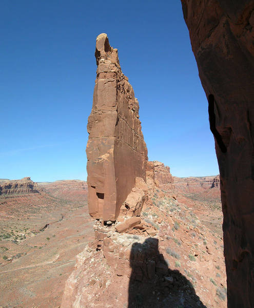 A view of the slender profile of North Tower with the shadow of Arrowhead Spire in the foreground.