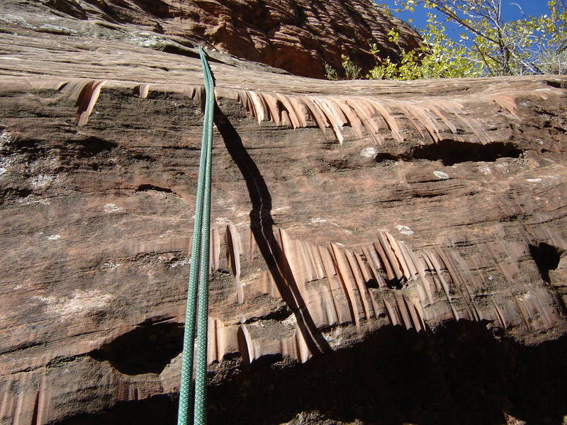 Sandstone erosion as the result of many pulled ropes...