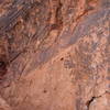 The route up the center of the photo; notice the chalk leading to the small flake undercling, and the chains at the top center.