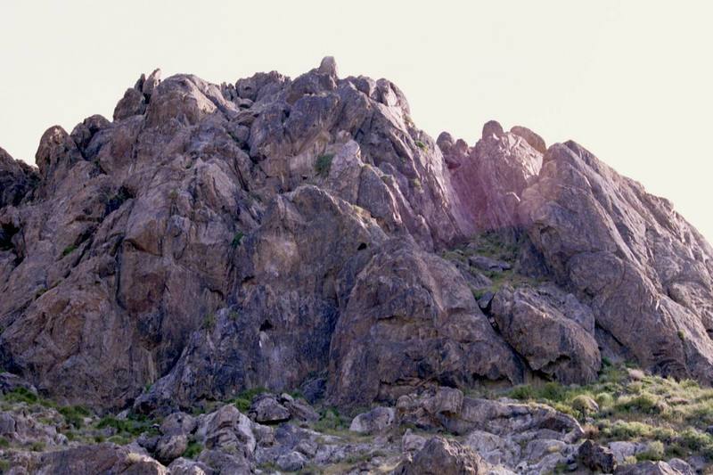 The northeast face of The Getaway(main face on the left), The Upper Getaway can be seen, in the upper right portion of the pic(grassy area with the smoth slab).<br>
photo by Jack Marshall