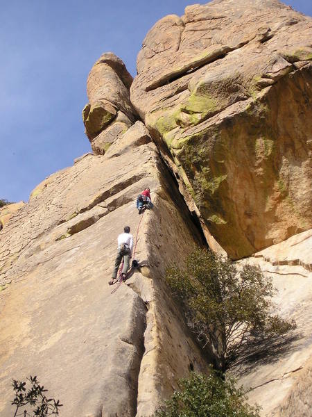 I am at the first belay in the white shirt.  James Q Martin works up the runout arete above. What he's looking at I have no idea.  The route ends on top of the detached tower above us.