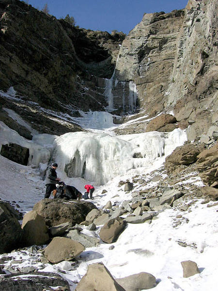 Suiting up in chains for the FINAL approach - 2,10ft sections of Ice separated by 80ft. ice ramp. Hostile T is at the far back of this gully.