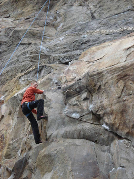 James Otey moveing past the triangle hold half way up the route...