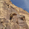 Above the tower looms the sustained, thin 5.8 corner that is on the right-hand variation to the Rainbow Buttress route.