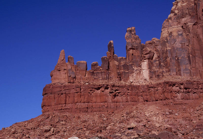 The Charlie Horse Needle (right) from the approach. (south)<br>
<br>
The other spires are unnamed and, as far as I know, unclimbed. This is probably because there are no crack systems that run to the summits and there is a fixed anchor ban in Canyonlands.