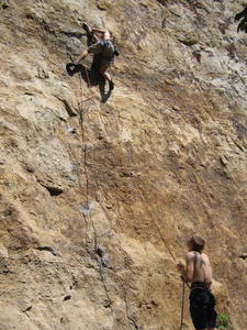 Jonathan Williams moving into the hueco jugs on Chinese Freedom. Photo by Meg Lelonek, 2005. Ben Bodenhamer belaying.