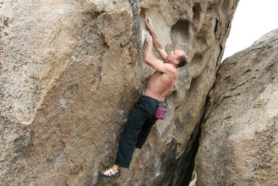 Mike moving through the crux of Bowling Pin, V4.