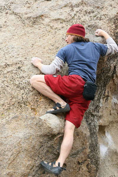 Pulling onto the final slab of Bowling Pin, V4.