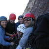 The "nice ledge" atop pitch 4 mentioned in the super topo is not so nice for 8 people.  There are two people that are out of frame.