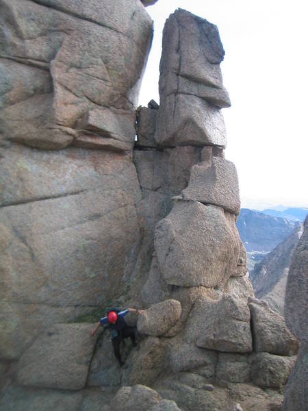 John Prater in the notch on Jagged where the standard route traverses onto the South face.