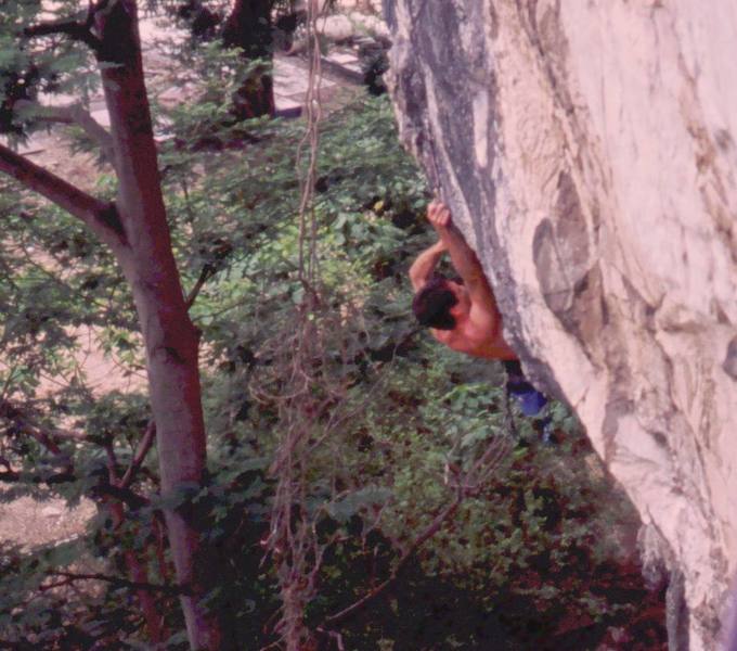 Tony coming out of the big roof on Lost Monkey (5.11) at Nanyang Wall of the Batu Caves area in K.L. Malaysia. Photo by Kenny Low, 2005.