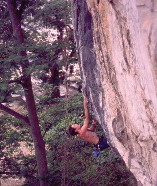 Tony coming going for the crux of 'Lost Monkey (5.11)' at Nanyang Wall of the Batu Caves area in K.L. Malaysia. Photo by Kenny Low, 2005.