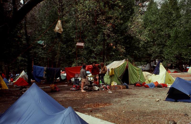 There was a lot to discuss in Camp 4 and no lack of opinions. Early 80s (Art Higby, Scott Woodruff, Olaf Mitchell) <br>
Notice the coolers and food bags hanging from the trees for bear protection.