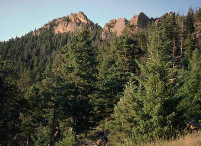 The Veil (right) and Physical Crag (left) as viewed from the Eldoardo Canyon Trail approach. Photo by Tony Bubb, 1996.