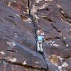 Erin just past the crux and one move to go before the pitch one anchors.