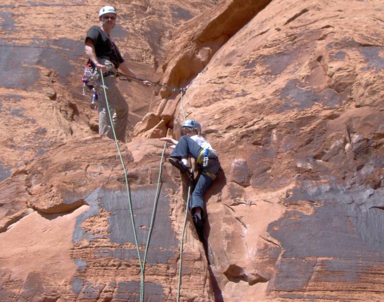 9 year old Marianna navigating the crux on Fistful of Potash just below the route's summit.