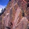 An unknown climber follows 'Pony Express (5.11)' on Eldo's West Ridge. Photo by Tony Bubb, 2003.