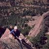 Joseffa Meir tops out on the lower right summit of Shirt Tail Peak in Eldo, via G.P. Direct. This is is the one of the nicest autumn viewpoints in Eldo