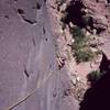 Josh Janes approaches the steep section on 'Night (5.11)' on Eldo's Redgarden Wall. Photo by Tony Bubb in 2004.