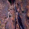 Joseffa Meir steps up to follow on P1 of 'Rosy Cruxifixion (5.10)', On Eldo's Redgarden Wall. Photo by Tony Bubb, 2004.