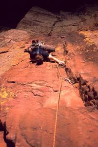 Dave Stewart being chased by shadows on the Crux of 'Three Old Farts Young At Heart (5.10d)' on Redgarden Wall, in Eldo. Photo by Tony Bubb, 2004.