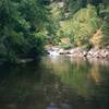 The Boulder Canyon streamside is virtually deserted at mid-weekday but can be a huge social scene on weekends and hot afternoons. This is a good palce to cool your feet after climbing. Photo by Tony Bubb, Y2K.