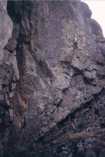 Thom Engelbach finds some gear on Arms Bazaar (12a, S) on Bell Buttress, on an otherwise gloomy day in Boulder Canyon. Photo by Tony Bubb, 2002.