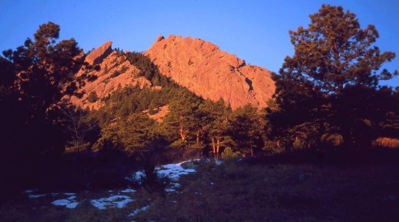 The First Flatiron is probably the most climbed formation in the North flatirons and perhaps one of the most beautiful at sunrise. Photo by Tony Bubb, 1997.