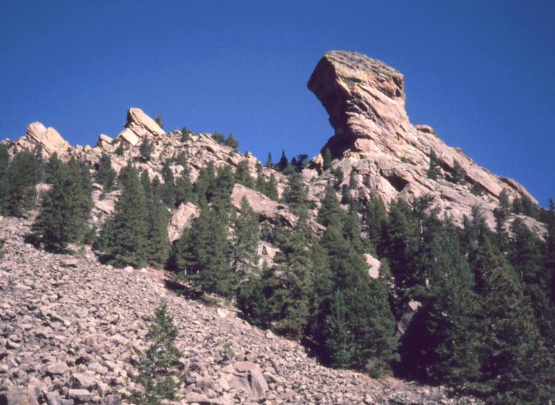 The Devil's Thumb as seen from the Shadow Canyon approach. Although this is a simple 'flatiron' it has what must be the biggest overhanging face in Boulder County. Photo by Tony Bubb, 2002.