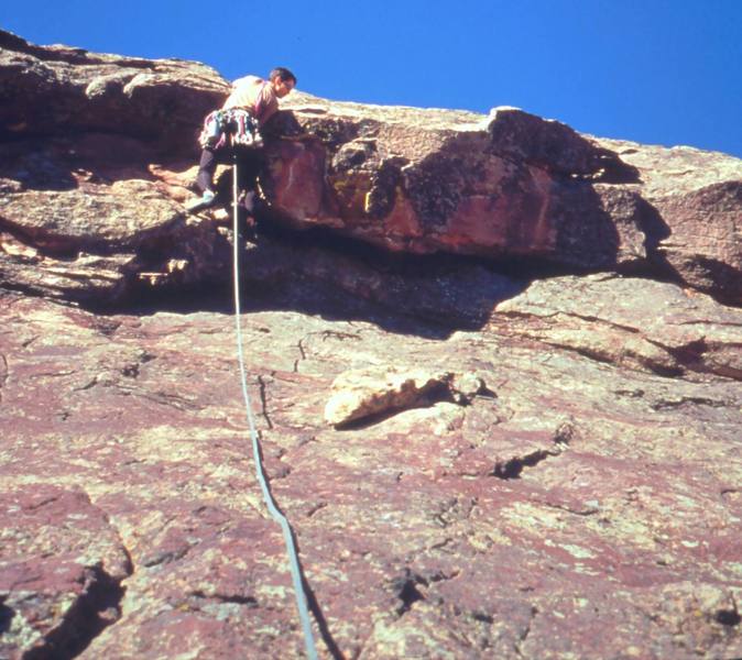 Tony Bubb starts up the steep section at the bottom of the East Face Left- this particular variation was much harder than 5.5, but I am not sure where it was supposed to go!<br>
<br>
Photo by John Saccardi, 2002.